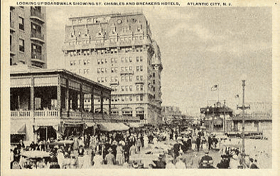 Looking up Boardwalk showing St.Charles and Breakers hotels, Atlantic city, N.J. (pohled)