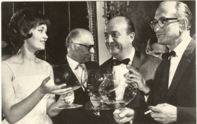 Larisa Lužinová, A. M. Brousil, B. Blier a M. I. Romma (pohled)